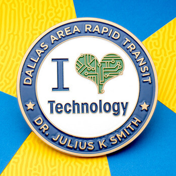 Dallas Area Rapid Transit challenge coin featuring an I Love Technology design with a green circuit board heart on a yellow and blue background.