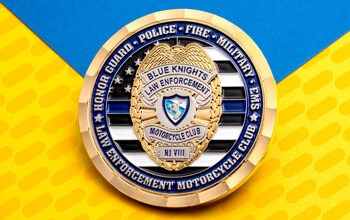 Gold challenge coin for Blue Knights Law Enforcement Motorcycle Club Honor Guard with thin blue line motif.